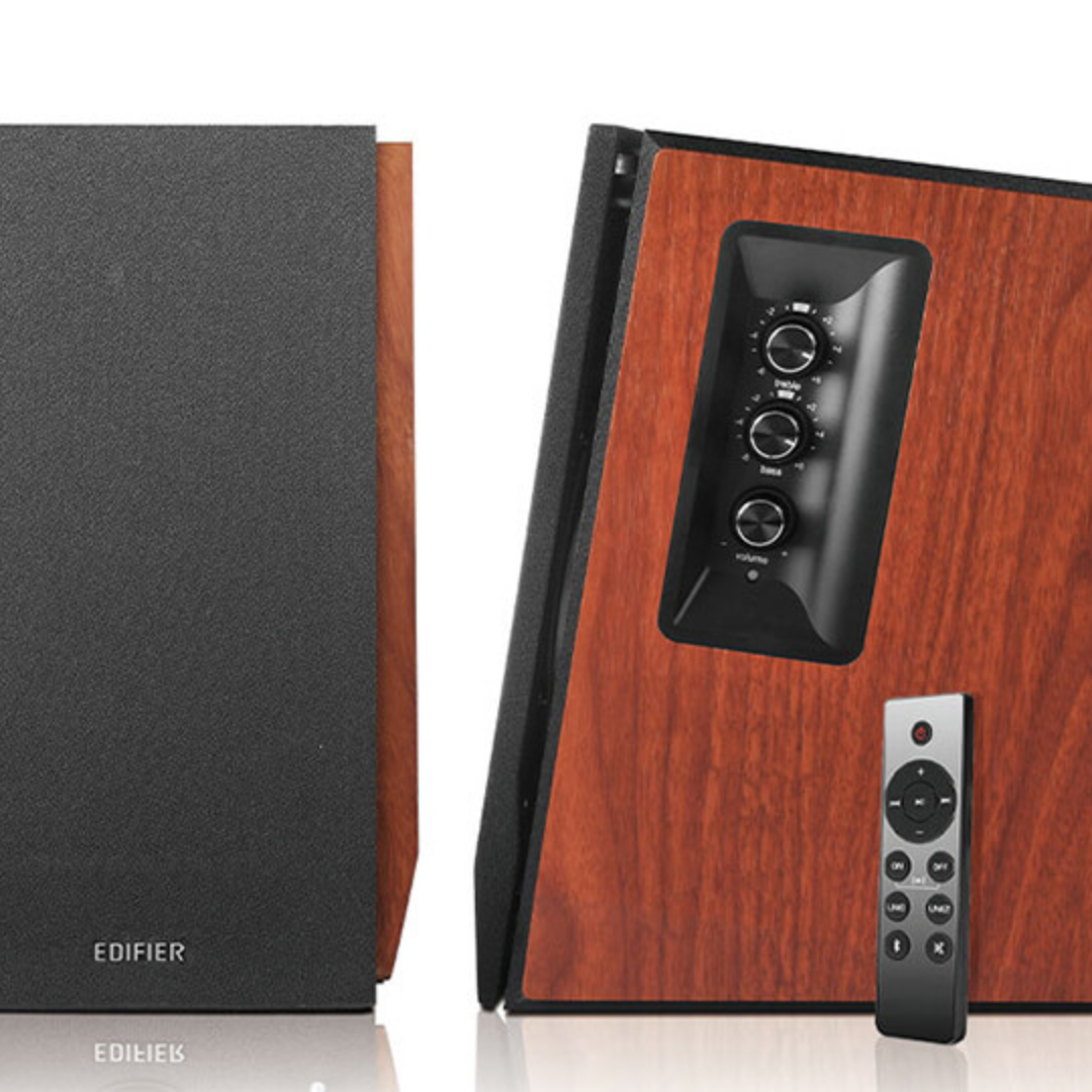 Front view of stylish wood brown Edifier R1700BTs speakers, one showcasing the front, the other revealing the side profile of the speaker with volume control and remote.