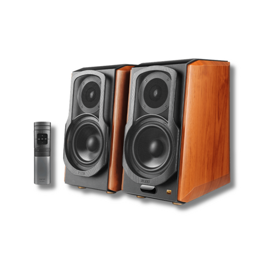 A pair of wood brown Edifier bookshelf speakers shown with a small gray remote control below them.
