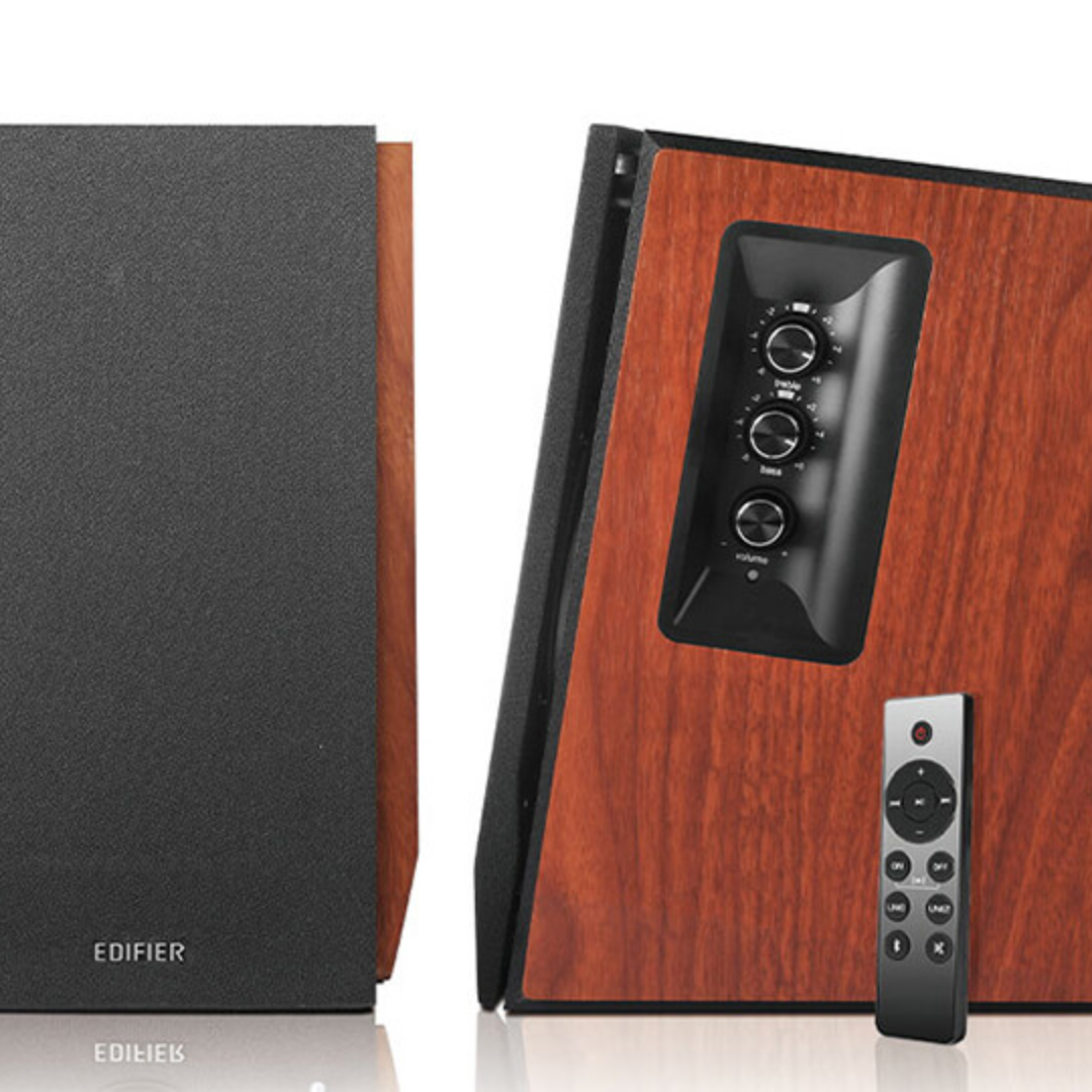 Front view of stylish wood brown Edifier R1700BTs speakers, one showcasing the front, the other revealing the side profile of the speaker with volume control and  remote.